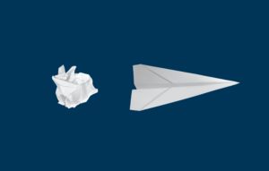 A white piece of paper crumpled with a paper airplane to the right, indicating one is transformed into the other.